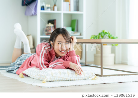 High school girl relaxing in a room High school girl relaxing in a room 129061539