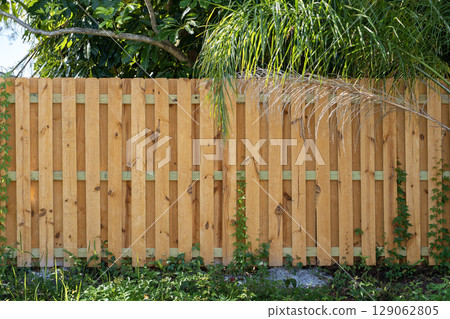 Privacy fence surrounding private property grounds for backyard protection in southern Florida 129062805