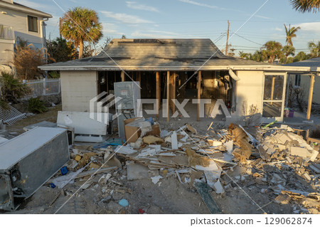 Natural disaster and its consequences. Hurricane destroyed houses roof and walls in Florida coastal area 129062874