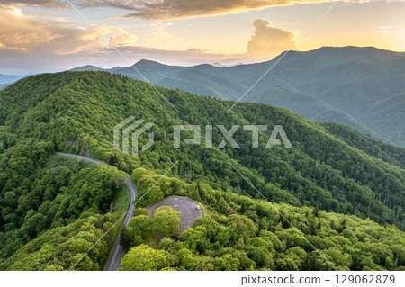 Mount Mitchell Overlook on Blue Ridge Parkway road in summer woods of Appalachian mountains. Road trip driving in wild nature in summertime season Mount Mitchell Overlook on Blue Ridge Parkway road in summer woods of Appalachian mountains. Road trip driving in wild nature in summertime season 129062879