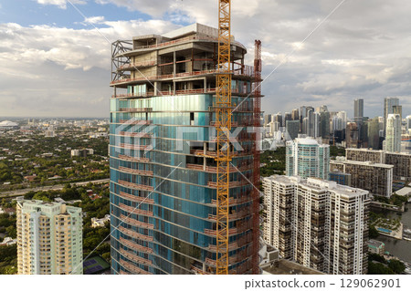 Miami, Florida. New construction site of developing residence in American urban area. Concept of housing growth in the USA Miami, Florida. New construction site of developing residence in American urban area. Concept of housing growth in the USA 129062901