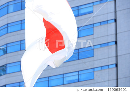Japanese flag fluttering in the wind Japanese flag fluttering in the wind 129063601