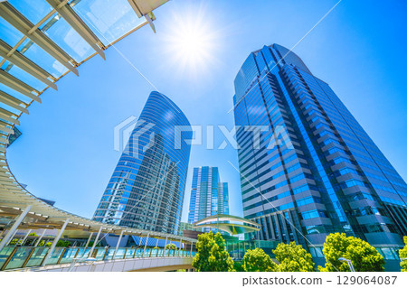 Tokyo cityscape in Japan: A ray of hope... July. Extremely hot... Overlooking the office buildings in front of Shinagawa Station. Towards a new era = 26th 129064087
