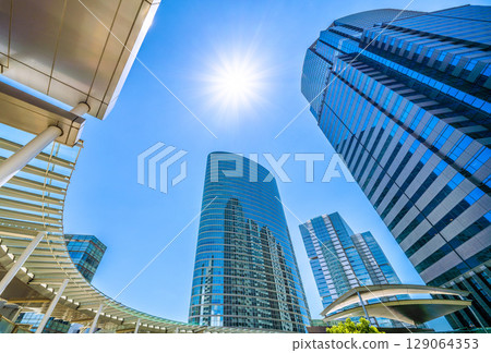 Tokyo cityscape in Japan: A ray of hope... July. Extremely hot... Overlooking the office buildings in front of Shinagawa Station. Towards a new era = 26th 129064353