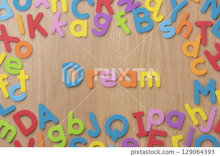 The English word Dream made up of colorful alphabets 129064393