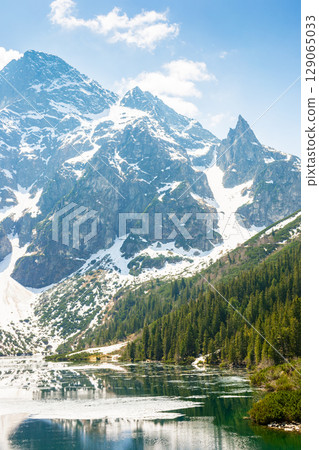 landscape with lake in tatra mountains of poland in spring.  scenic view of reflection in water. outdoor adventure and vacation season on morskie oko 129065033