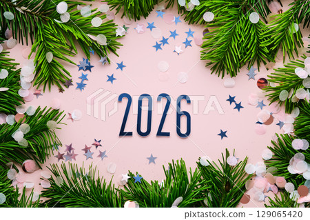 New Year 2026 pink background. Number of the coming year in Christmas decoration. New Year 2026 pink background. Number of the coming year in Christmas decoration. 129065420