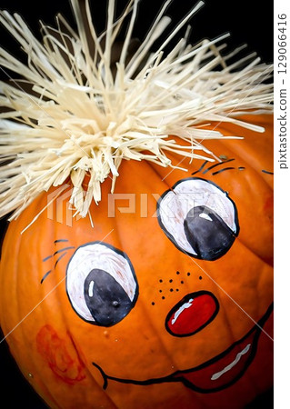 Painted Pumpkin with Straw Hair Painted Pumpkin with Straw Hair 129066416
