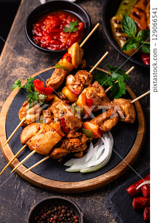 Assortment of grilled bbq meat and vegetables Assortment of grilled bbq meat and vegetables 129066541