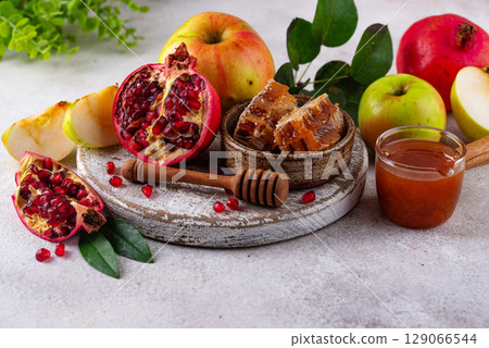 Rosh Hashana concept with honey, apple and pomegranate 129066544