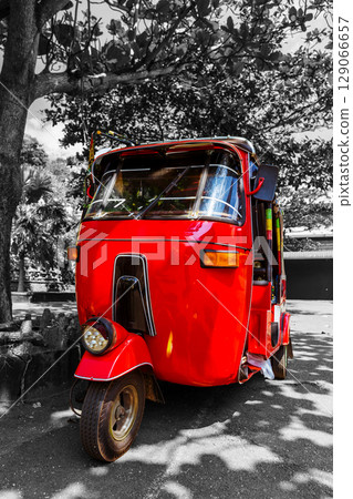 Bright red auto rickshaw 129066657