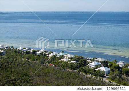 Large residential homes in island small town Boca Grande on Gasparilla Island in southwest Florida. American waterfront houses in rural US suburbs 129066811