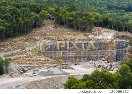 Large quarry with processing plant for crushed stone. Extracting of natural resources for construction industry Large quarry with processing plant for crushed stone. Extracting of natural resources for construction industry 129066812