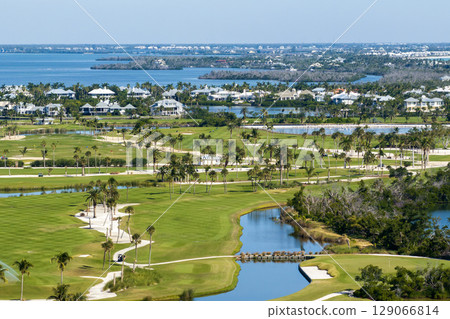 Large golf course and sports grounds with green grass in Boca Grande, small town on Gasparilla Island in southwest Florida 129066814