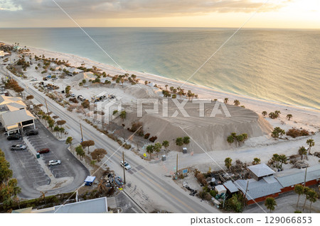 Hurricane Milton aftermath cleanup. Sand recipient site for residents to dump sand after storm surge. Huge sand piles at Englewood Beach on Manasota Key 129066853