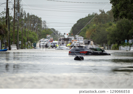 Hurricane Debby flooded city street with trapped cars submerged under water in Florida residential area. Consequences of natural disaster Hurricane Debby flooded city street with trapped cars submerged under water in Florida residential area. Consequences of natural disaster 129066858