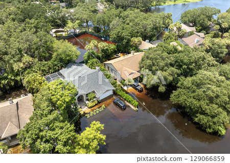Hurricane Debby flooded cars and homes in Sarasota, Florida. Aftermath of natural disaster Hurricane Debby flooded cars and homes in Sarasota, Florida. Aftermath of natural disaster 129066859