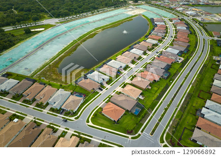 Ground prepared for building of new residential houses in Florida suburban development area. Concept of growing american suburbs Ground prepared for building of new residential houses in Florida suburban development area. Concept of growing american suburbs 129066892