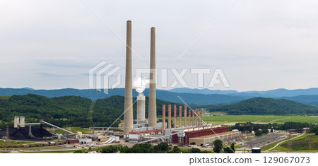 Coal-fired power plant producing electricity. Fossil fuel usage for energy production Coal-fired power plant producing electricity. Fossil fuel usage for energy production 129067073