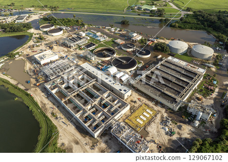 City water cleaning facility at wastewater treatment factory. Purification process of removing undesirable chemicals, suspended solids and gases from contaminated liquid City water cleaning facility at wastewater treatment factory. Purification process of removing undesirable chemicals, suspended solids and gases from contaminated liquid 129067102