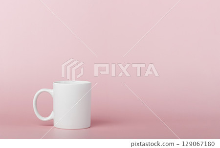 white cup for tea or coffee on a pink background white cup for tea or coffee on a pink background 129067180