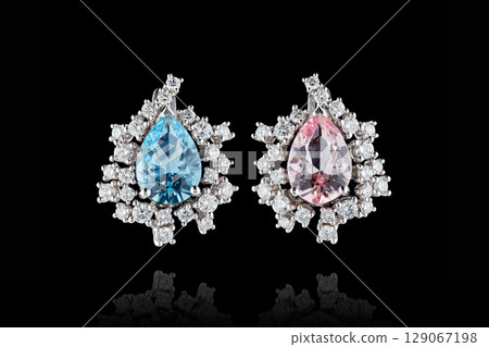 earrings silver, gold with stone aquamarine and morganite, diamonds on black background earrings silver, gold with stone aquamarine and morganite, diamonds on black background 129067198