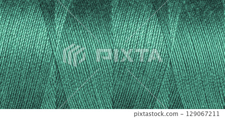 Green sewing thread texture Green sewing thread texture 129067211