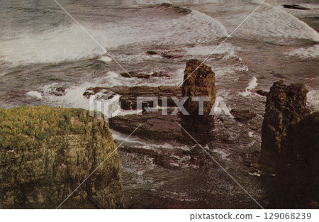 USSR, Russia - circa 1981: Postcard with a view of the Commander Islands. Rocks off the coast of Bering Island. Retro postcard. USSR, Russia - circa 1981: Postcard with a view of the Commander Islands. Rocks off the coast of Bering Island. Retro postcard. 129068239