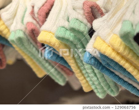 Colorful socks arranged in neat stacks at a trendy store 129068756