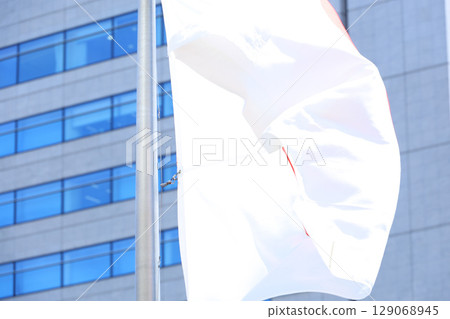 Japanese flag fluttering in the wind Japanese flag fluttering in the wind 129068945