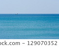 Yacht floating on turquoise waters 129070352