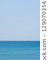Yacht floating on turquoise waters 129070354