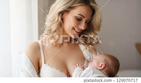 Mother giving breast milk to baby 129070717