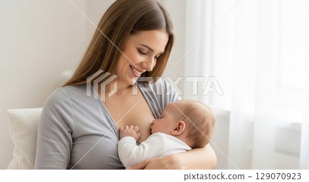 Mother holding baby 129070923