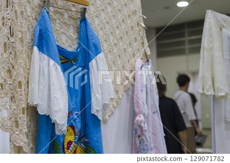 Blue and white dress on display and for sale, lace 129071782