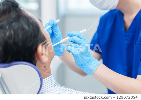 Dentist cavity treatment 129072054