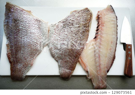Filleted sea bream (knife and cutting board provided) Filleted sea bream (knife and cutting board provided) 129073561