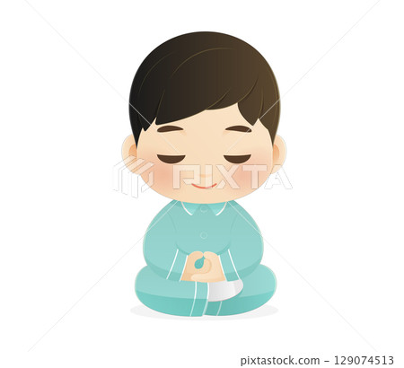 A cute boy meditates in pajamas before sleep. Calm and peaceful mood. A cute boy meditates in pajamas before sleep. Calm and peaceful mood. 129074513