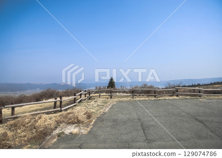 March 25 2025 Countryside View With Wooden Fence and Blue Sky Horizon, Japan March 25 2025 Countryside View With Wooden Fence and Blue Sky Horizon, Japan 129074786