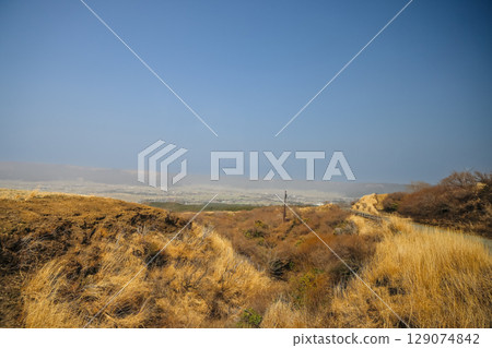March 25 2025 Scenic Landscape with Vast Sky and Peaceful Countryside Fields, Japan March 25 2025 Scenic Landscape with Vast Sky and Peaceful Countryside Fields, Japan 129074842