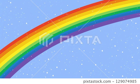 Colorful rainbow arcing across a blue sky with scattered clouds. 129074985