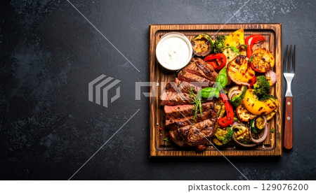 Grilled steak and roasted vegetables make a delicious gourmet dinner plate Grilled steak and roasted vegetables make a delicious gourmet dinner plate 129076200
