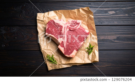 Heart-shaped raw meat snacks on a wooden board 129076204