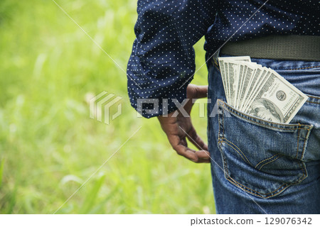 Hand holding loan money dollar bank note give financial payment. Man hands showing spread 100 dollar exchange cash payout. Saving Businessman counting money banknote bribe corruption concept. Hand holding loan money dollar bank note give financial payment. Man hands showing spread 100 dollar exchange cash payout. Saving Businessman counting money banknote bribe corruption concept. 129076342