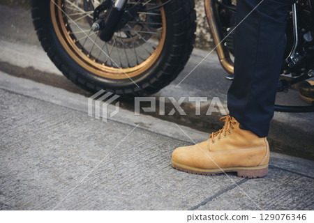 Men wear construction Boots safety footwear for worker at construction site. Engineer Wear Jeans Brown Boots Worker on Background of Refinery. Engineer safety industry fashion footwear walking outdoor Men wear construction Boots safety footwear for worker at construction site. Engineer Wear Jeans Brown Boots Worker on Background of Refinery. Engineer safety industry fashion footwear walking outdoor 129076346