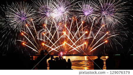 Colorful vibrant Firework celebrate anniversary happy new year 2024, 4th of july holiday festival. colorful firework in night time to celebrate national holiday. countdown new year party background Colorful vibrant Firework celebrate anniversary happy new year 2024, 4th of july holiday festival. colorful firework in night time to celebrate national holiday. countdown new year party background 129076379