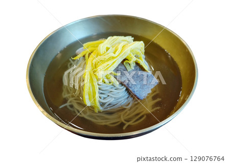 Refreshing traditional Korean cold buckwheat noodles with beef and egg strips in clear broth perfect summer dish Refreshing traditional Korean cold buckwheat noodles with beef and egg strips in clear broth perfect summer dish 129076764