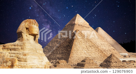 night scene of the castle pyramid in the desert 129076903