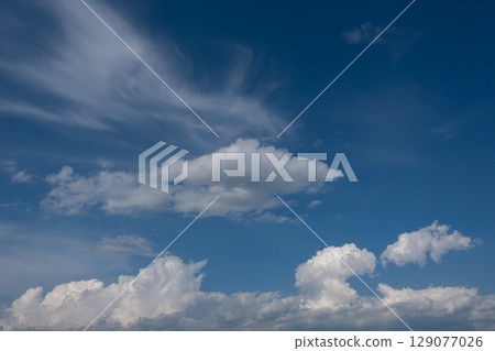 White clouds floating in the blue sky White clouds floating in the blue sky 129077026