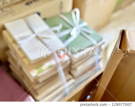 Image of a stack of books bound with string 129077807
